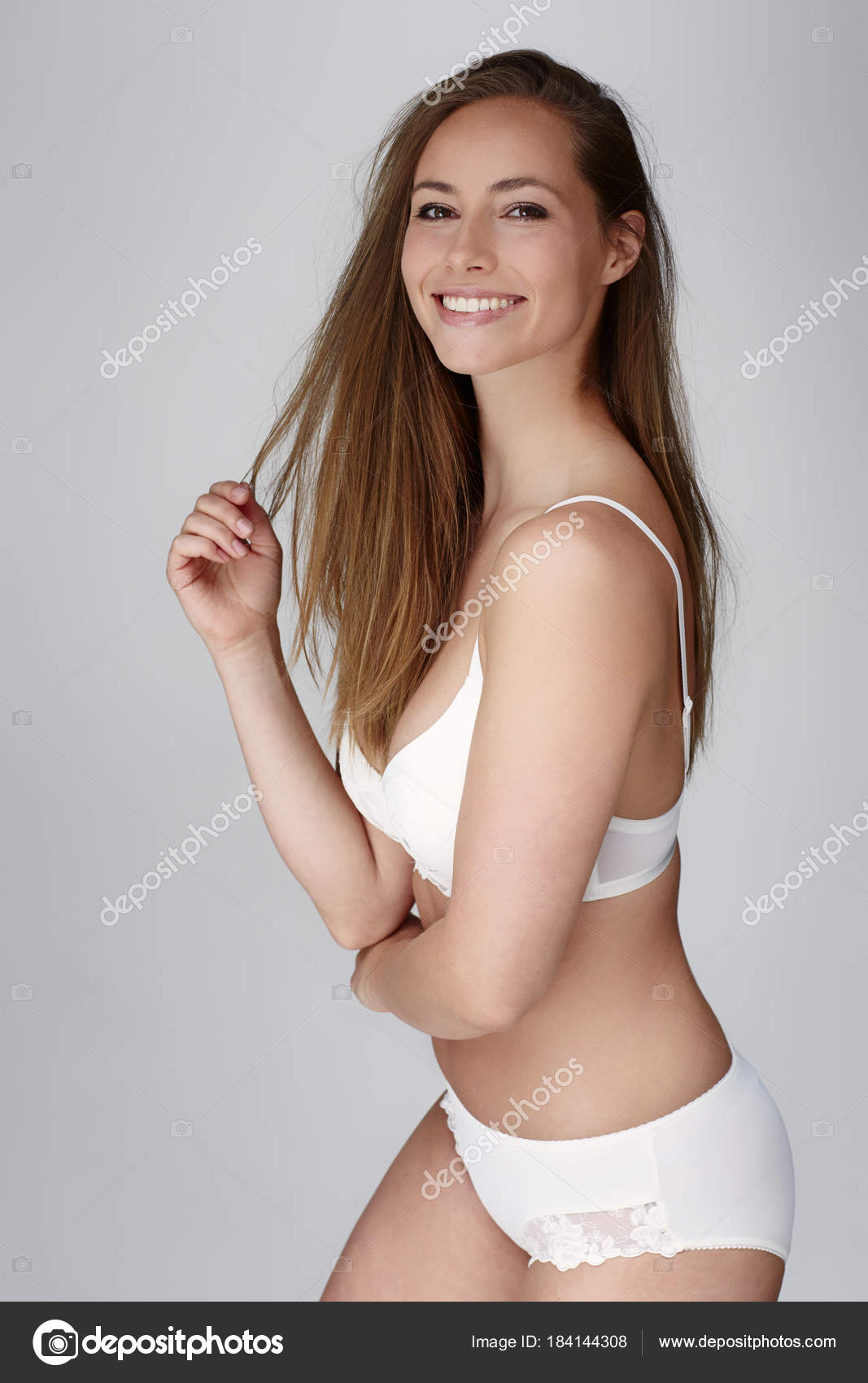 Young Woman Posing White Underwear Smiling Camera Stock Photo by