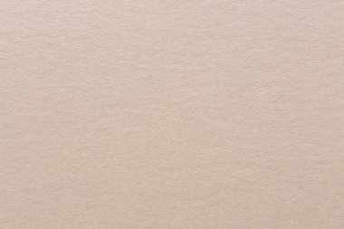 Hafif bej kağıt dokusu yakın çekim.