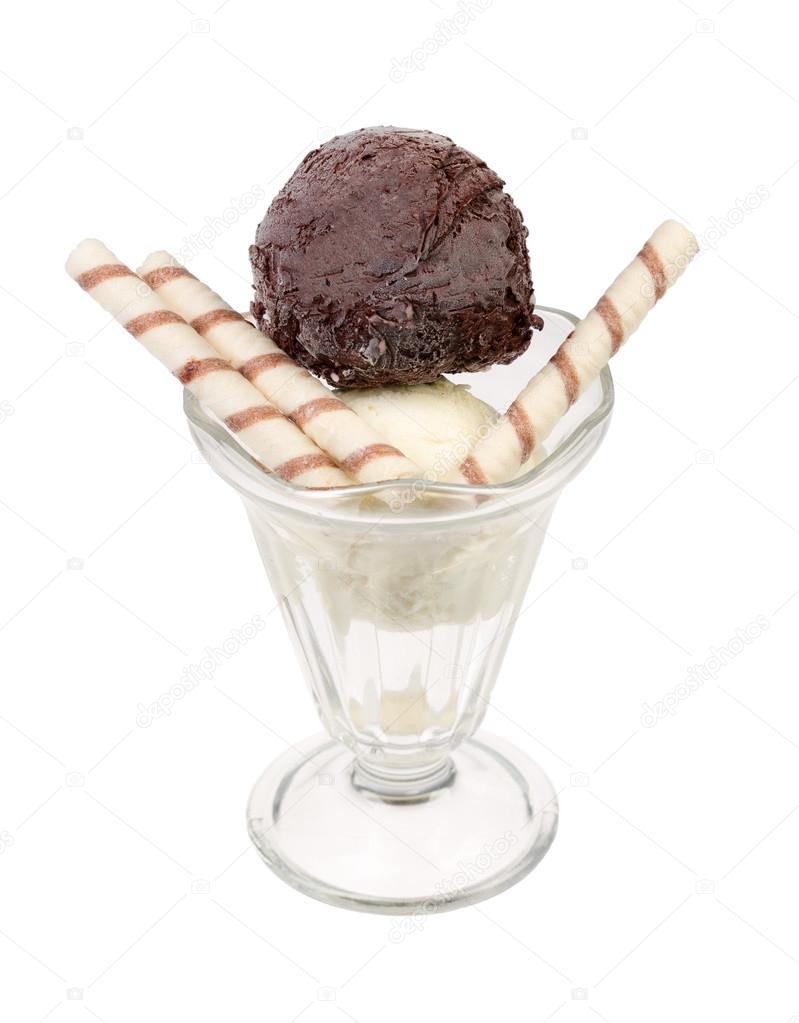 Creamy sundae ice cream in cup with wafer rolls.