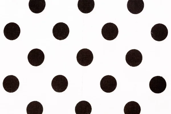 Black polka dot over white fabric background and texture. — Stock Photo, Image