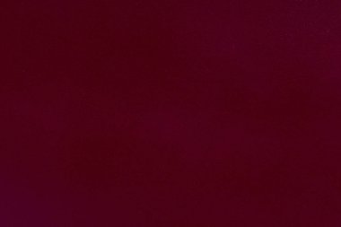 Arka plan koyu kırmızı deri.