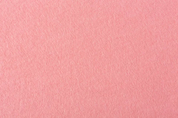 Close up vista de detalhe de um pedaço rosa de feltro texturizado . — Fotografia de Stock