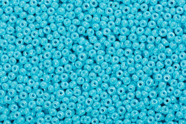 Many baby blue glass cane beads. — Stock Photo, Image