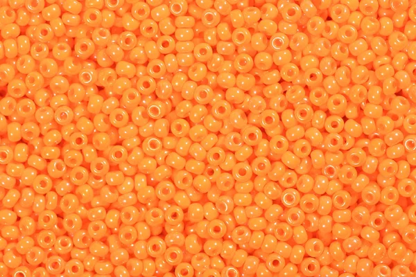 Bright orange seed beads. — Stock Photo, Image