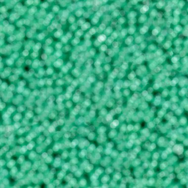 Soyut yeşil bokeh arka plan. Sorunsuz doku. Döşeme hazır.