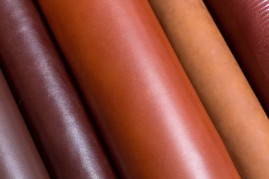 Natural shinny leather samples for fashion industry. clipart