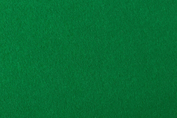 Green felt fabric for background.