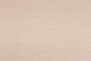 Hafif bej kağıt dokusu yakın çekim.