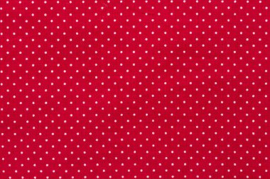 Kırmızı tuval, pamuk dokusu, kumaş arkaplanı üzerindeki polka nokta