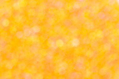 Turuncu zemin üzerine sarı ve turuncu bokeh.