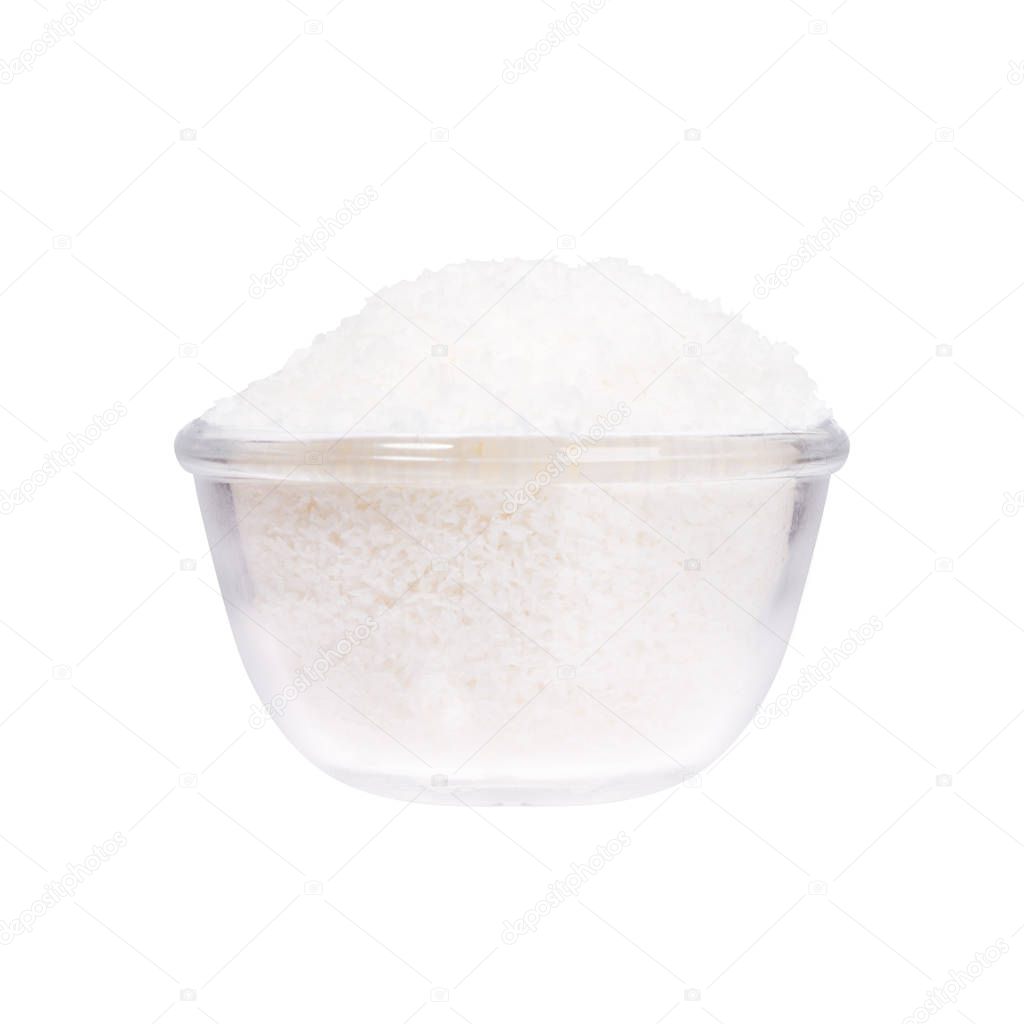 Sea salt in a saucer on white background. 