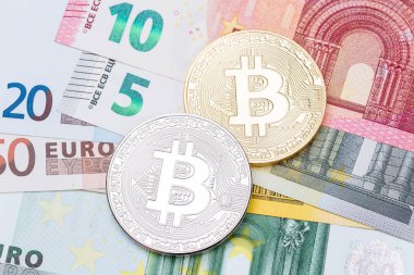 Euro ve dolar arka plan ile altın ve gümüş bitco kaplı