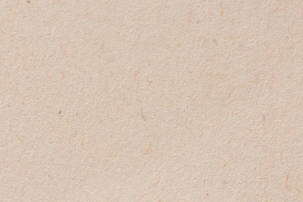 Un fondo de papel de tonos cálidos y blanquecinos con una textura fina — Foto de Stock