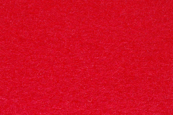 Esmagado vermelho altamente texturizado fundo para o Natal. — Fotografia de Stock