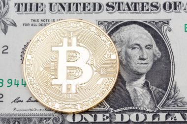 Altın bitcoin sikke üzerinde bir dolarlık banknot kadar yakın.