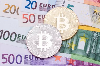 Euro ve dolar arka plan ile altın ve gümüş bitco kaplı