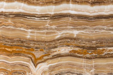 Bej Traverten arka plan. Dalgalı çizgiler doku.