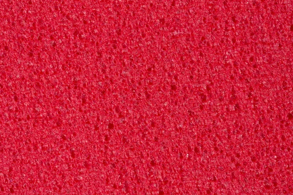 Kontrast crimson skum (Eva) textur med porositet på surface. — Stockfoto