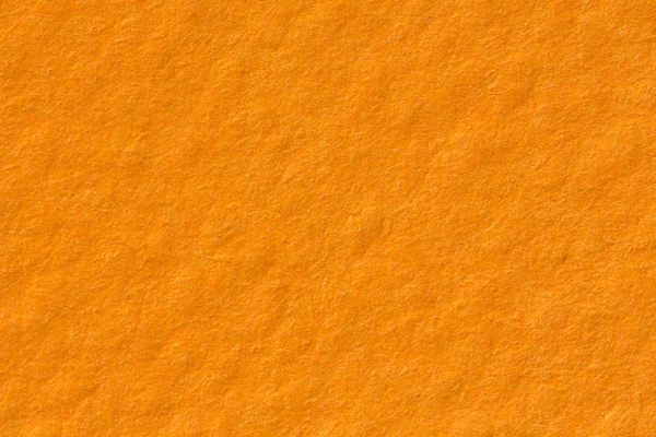Orange paper texture background. Plain backdrop.