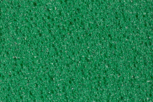 Calm green foam (EVA) texture with contrast porous surface.