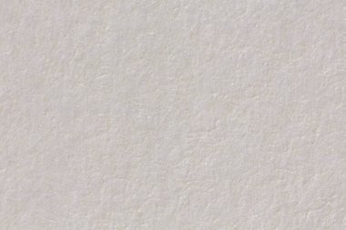 Hafif bej kağıt doku arka planını yakın çekim.