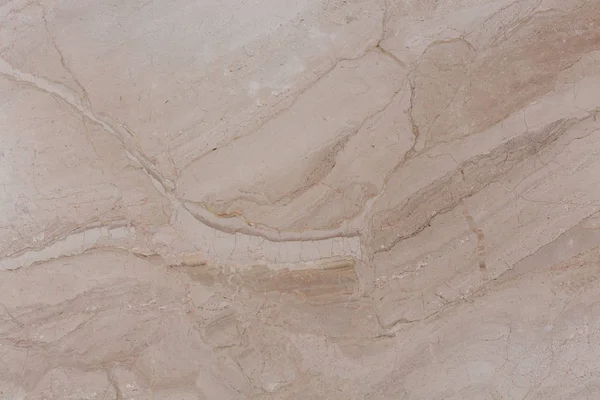 Szelíd bézs márvány textúrája, egyenetlen felületű. — Stock Fotó