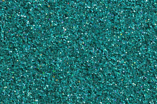 Turquoise shining background with glitter. High quality texture in extremely high resolution.