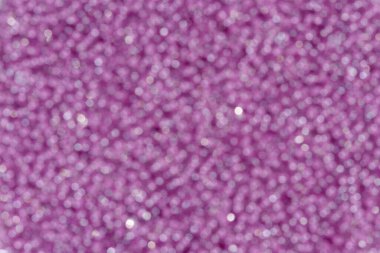Bokeh texture. Background of bright lavendel glitter bokeh.
