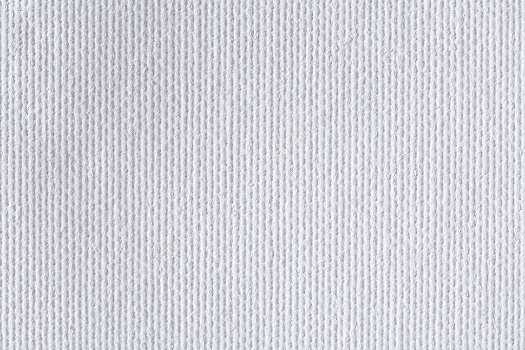 Background from white coarse canvas texture. High quality background.