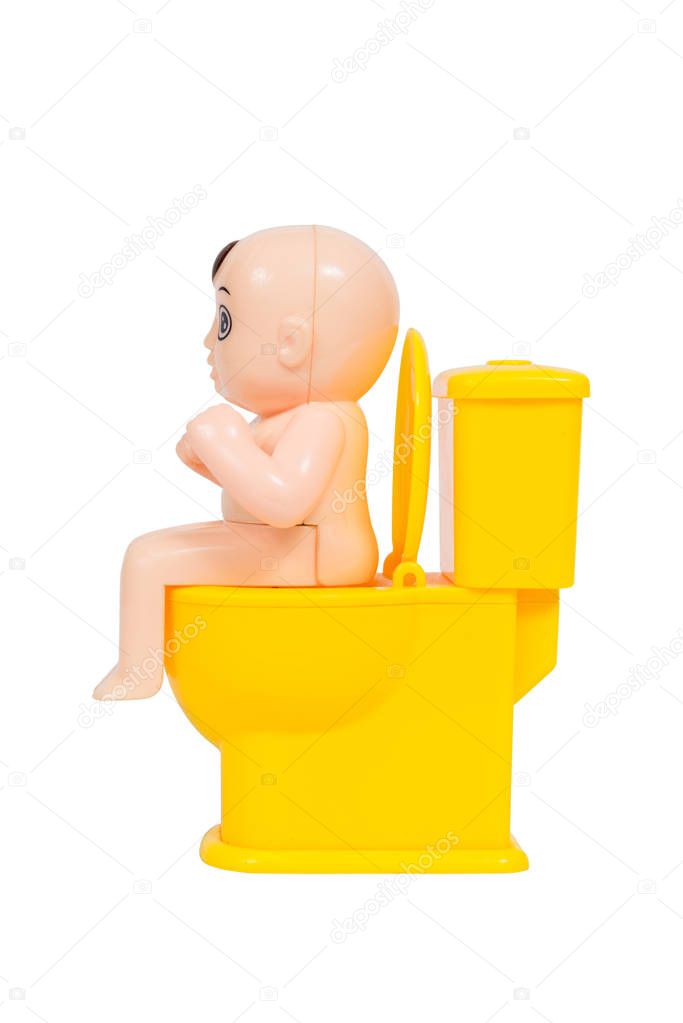 Doll, baby toy sit on toilet bowl, isolated on white background