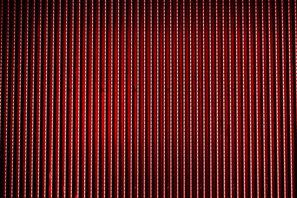 Czerwony metalowy stal tło z jasnym środku spotlight i blac — Zdjęcie stockowe