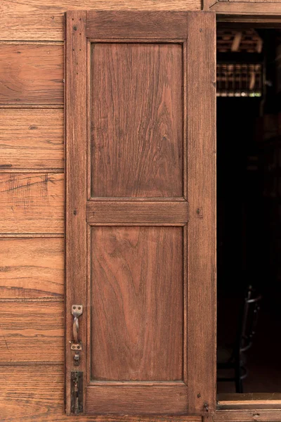 Old grunge wood simple door and wooden wall