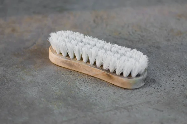 Old cleaning brush or washing brush on concrete floor. — Stock Photo, Image