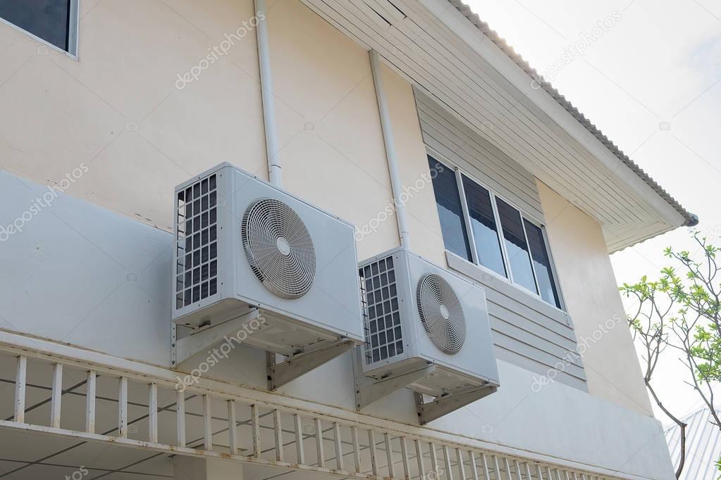 Air conditioner compressor unit hanging on the wall, 