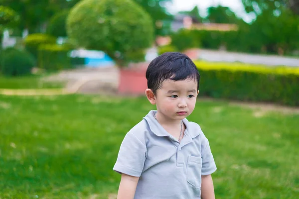 Little Asian kid at the playground under the sunlight, shallow D — Stock Photo, Image