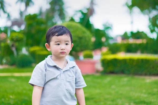 Little Asian kid at the playground under the sunlight, shallow D — Stock Photo, Image