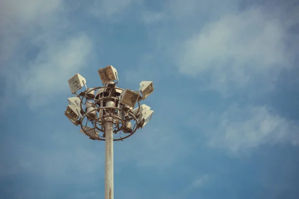 Lamp post electricity industry with blue sky. Spotlight tower.