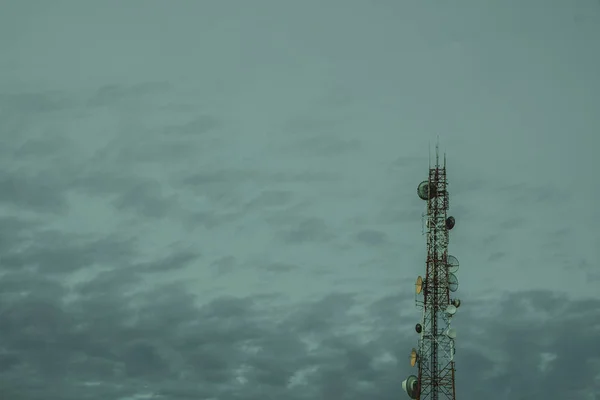 Mobile phone communication antenna tower with the blue sky and c — Stock Photo, Image