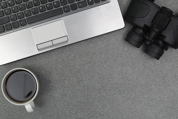 Laptop computer or notebook, binocular and cup of coffee on work — Stock Photo, Image