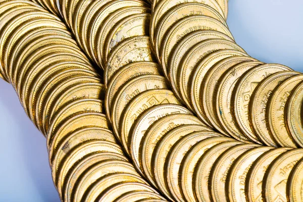 Columns of gold coins, piles of coins on white background