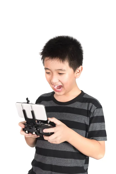 Asiatischer Junge hält Hexacopter-Drohne und Funkfernbedienung in der Hand — Stockfoto