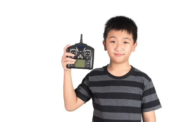 Asiático niño sosteniendo radio mando a distancia auricular para helicóptero, d —  Fotos de Stock