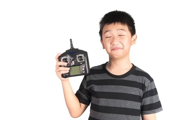 Asian boy holding radio remote control handset for helicopter, d — Stock Photo, Image