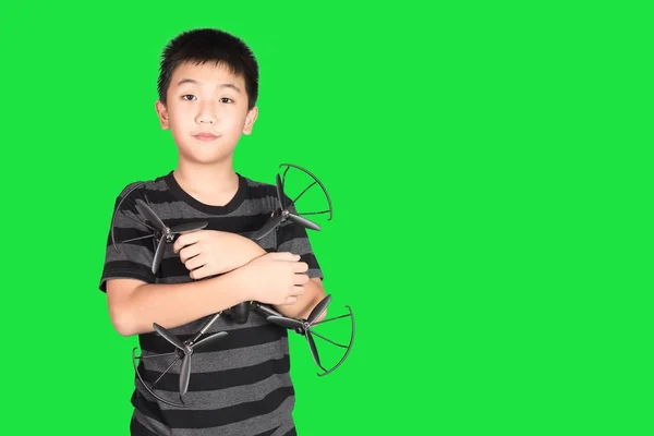 Asian boy holding drone or quad copter toy in hand, isolated on — Stock Photo, Image