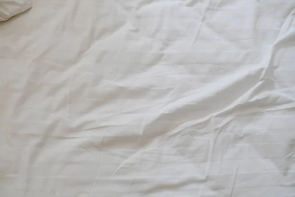 Fehér finom puha háttér a szövet vagy ágyneműt lap — Stock Fotó