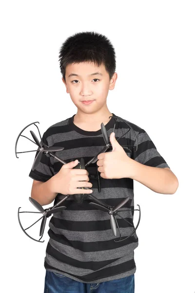 Asian boy holding drone and giving thumbs up, isolated on white — Stock Photo, Image