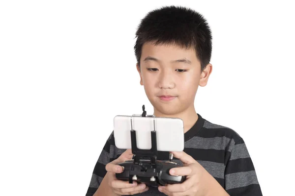 Asian boy holding radio remote control handset for helicopter, d — Stock Photo, Image