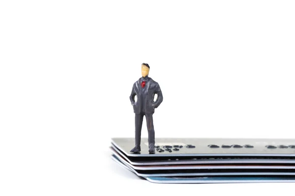 Figure miniature businessman or small people standing with stack — Stock Photo, Image