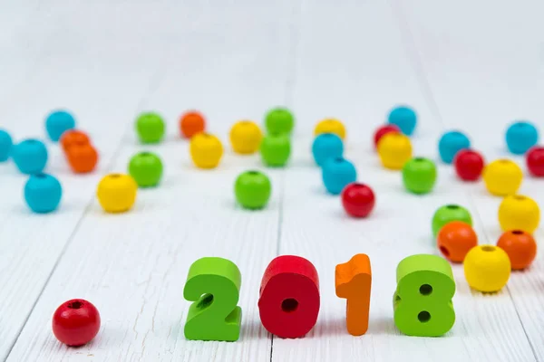 2018 colorful wooden text on white wooden desk with Christmas de — Stock Photo, Image