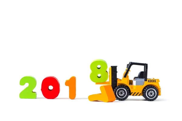 Mini forklift truck loading text number eight to complete year 2 — Stock Photo, Image